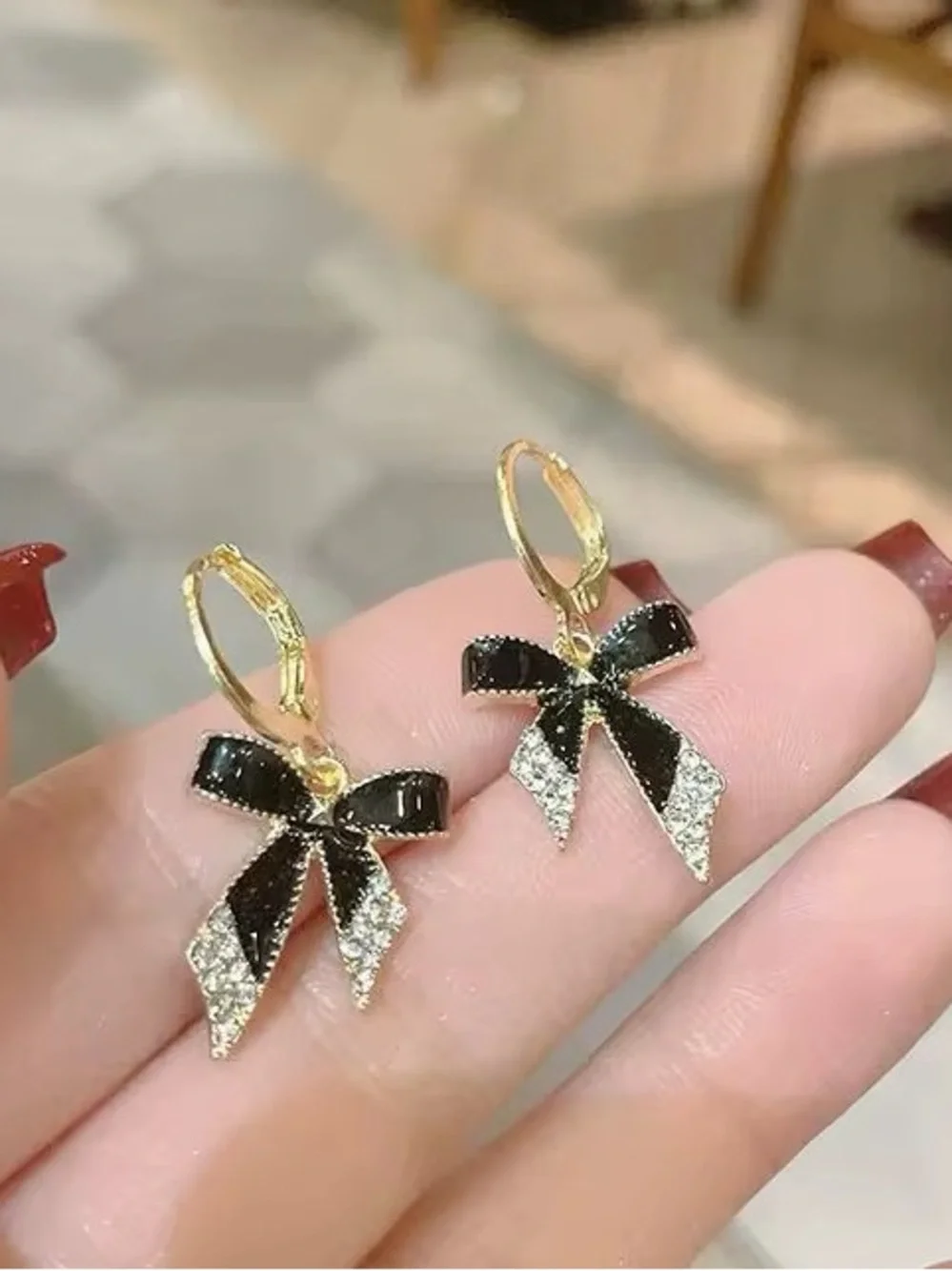 *** Delicate Gold Bow Drop Earrings with Black Enamel and Crystal Accents